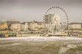 Dangerous waves threaten promenade and big wheel.