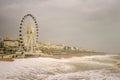 Storm Desmond rough sea waves hit big wheel on promenade