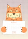 2022 november calendar, cute puma lynx cat animal holding a monthly calendar