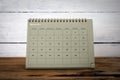 NOVEMBER 2024. Cardboard desk calendar and planner on a wooden texture table