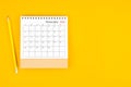 November2023 desk calendar and wooden pencil on yellow background. Time planning, day counting and holidays