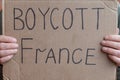 2 November 2020 France Paris: A man holds a cardboard poster with the inscription Boycott of France