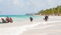4 November 2015, A Group of People Walking into the Sea for Scuba Diving, in a Tropical Beach Hotel Resort, Punta Cana. Royalty Free Stock Photo