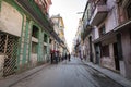 View of authentic street with old colonial buildings and local people at every day life. old part of Havana City Royalty Free Stock Photo