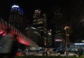 November 2019, Indonesia Nightscape of Modern South Jakarta with a new pedestrian bridge in the night near Transjakarta shelter