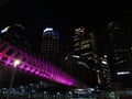 November 2019, Indonesia Nightscape of Modern South Jakarta with a new pedestrian bridge in the night near Transjakarta shelter