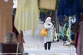 12 november 2023, Lisbon, Portugal A woman in muslim clothes standing on a sidewalk looking at her cell phone -