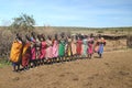 November 15, 2015, Masai Mara, Kenya, Africa. Colorfully Dressed Masai Women Getting Ready to Sing