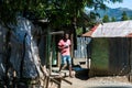 Dramatic image of a Haitian avocado farm worker preparing food for lunch