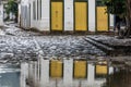 The historical colonial city of Paraty reflected on the water puddles after the rain