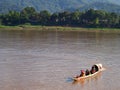 People travelling to work on normal daily lifestyle in transport boat at MEKONG river bank of LUANG PRABANG