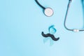 November Prostate Cancer Awareness, light Blue Ribbon with stethoscope and mustache for supporting people living and illness. Men