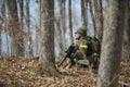 Active military exercises in the forest. Shootout army in the autumn forest. Training airsoft teams in Russia.