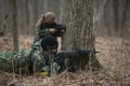 Active military exercises in the forest. Shootout army in the autumn forest. Training airsoft teams in Russia.