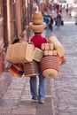 Vendor carrying merchandise in Mexico