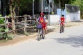 November 2018, School children boy girls uniform cycling village street, Vietnam Royalty Free Stock Photo