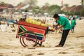 18 November 2012. The seller of roasted corn on the Bali Jimbaran beach Royalty Free Stock Photo