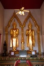 November 21th, 2018 - Bangkok THAILAND - Two standing golden Buddhas in thai temple