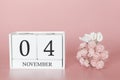 November 04th. Day 4 of month. Calendar cube on modern pink background, concept of bussines and an importent event Royalty Free Stock Photo