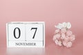 November 07th. Day 7 of month. Calendar cube on modern pink background, concept of bussines and an importent event