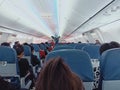 3 November 2021, Thailand  Inside a Lion Air passenger plane, there are passengers sitting on a boat leaving Don Mueang Airport. Royalty Free Stock Photo