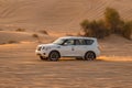 11 November 2021, UAE, Dubai: Desert Safari along the sand dunes in Dubai or Abu Dhabi, UAE - traditional entertainment for Royalty Free Stock Photo