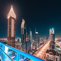 Night view of the spectacular landscape of Dubai with high-rises and skyscrapers at the Sheikh Zayed