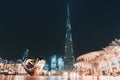 Panoramic view of illuminated Burj Khalifa building at evening. I love Dubai caption with iron heart