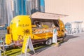 Woman customer buying lunch in fastfood wagon cafe