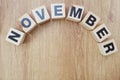 November wooden letter alphabet on wooden background