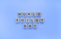 World Toilet Day, minimalistic banner with the inscription in wooden letters