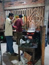 Photo editorial, 27 november 2022, yogyakarta, indonesia, mie godog maker and seller, using charcoal