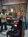 Photo editorial, 27 november 2022, yogyakarta, indonesia, mie godog maker and seller, using charcoal