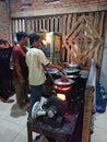 Photo editorial, 27 november 2022, yogyakarta, indonesia, mie godog maker and seller, using charcoal