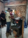 Photo editorial, 27 november 2022, yogyakarta, indonesia, mie godog maker and seller, using charcoal