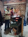 Photo editorial, 27 november 2022, yogyakarta, indonesia, mie godog maker and seller, using charcoal