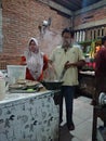 Photo editorial, 27 november 2022, yogyakarta, indonesia, mie godog maker and seller, using charcoal