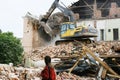 Novgorod, Russia, Aleksandr Kirillov - 08022019: An excavator destroys an old brick building