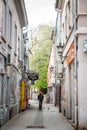 Selective blur on man walking in the Laze Teleckog street, an iconic pedestrian street of the city center of Novi Sad