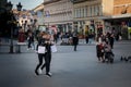 Two women, Serbs walking and eating ice cream in summer in the city center of Novi Sad, Serbia