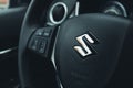 NOVI SAD, SERBIA - APRIL 12, 2021: Suzuki logo on its Vitara steering wheel. Illustrative editorial