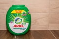 Ariel mountain spring laundry detergent 3 in 1 pods family pack on ceramic tiles, wooden