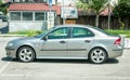 New silver Saab 9-3 car parked on the street in the city