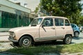 Old retro Renault 4 classic car parked on the street in the city.