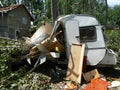 A camper damaged by hurricane with fallen tree in front of the house Royalty Free Stock Photo