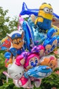 Various balloons with famous cartoon characters sold on street market