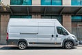 White Fiat Ducato cargo van with tall roof parked on the street.