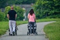 A young couple pushing a baby carriage