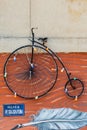 Historical Vintage Velocipede Bicycle Hanging on Street Wall in Novi Sad, Serbia