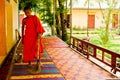 A novice Buddhist monk of a riverside temple in Kampot, Cambodia